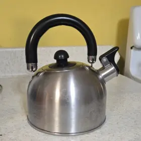 0912 Copco Stainless Steel Whistling Tea Kettle Silver And Black Model