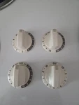 Kenmore Stove Top Knobs, White New. Price: $44.00.