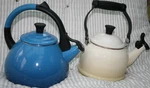 Lot Of 2 Creuset Ink Blue & Demi Ivory Enamel Whistling Tea Kettles Pots Used. Price: $40.00.