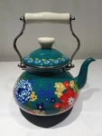 The Pioneer Woman Teal Dazzling Dahlias Enamel Steel 2 Quart Kettle Open. Price: $19.99.