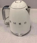 New Smeg Retro Style Electric Tea Kettle - Shiny Glossy White Model #KLF03 Open. Price: $219.00.