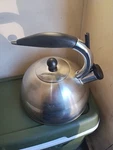 Kamenstein Kettle Teapot Metal Whistling Silver Tone Black Handle 2QT Hot Water Used. Price: $20.00.
