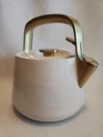 Caraway 2 Quart Whistling Tea Kettle, Cream W/pot Holder Flaws Used. Price: $49.95.