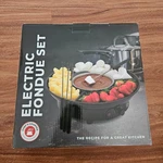 Chefs Counter New Electric Fondue Set Open. Price: $17.99.