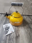 Creuset Nectar On Steel Whistling Tea Kettle With Metal Finishes, 1.7 Qt., Open. Price: $79.00.
