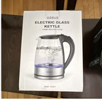 New Azeus Glass Cordless Electric Kettle CX-817 Clear Silver Black. Price: $70.00.