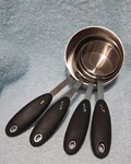 Measuring Cup Set Oxo Good Grips 4-PIECE Stainless Steel Soft Handles Used. Price: $14.99.