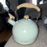 Belanko Light Green Stainless Steel Tea Kettle, Wood Handle, Whistling Spout Used. Price: $15.00.