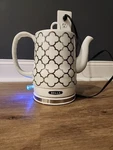 Bella Electric Ceramic 1.5 Tea Kettle Model KE7937-A White & Silver Used. Price: $99.99.