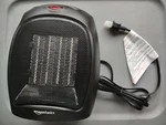 Brand New Amazonbasics 1500W Oscillating Ceramic Heater - Silver. Price: $15.00.